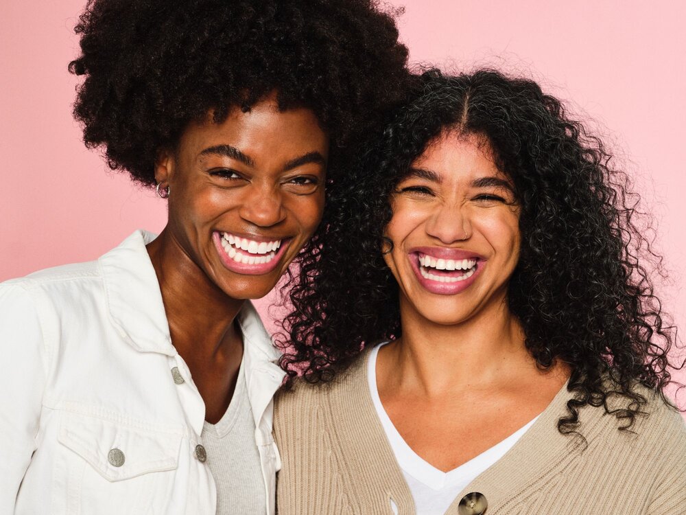 Two women smiling