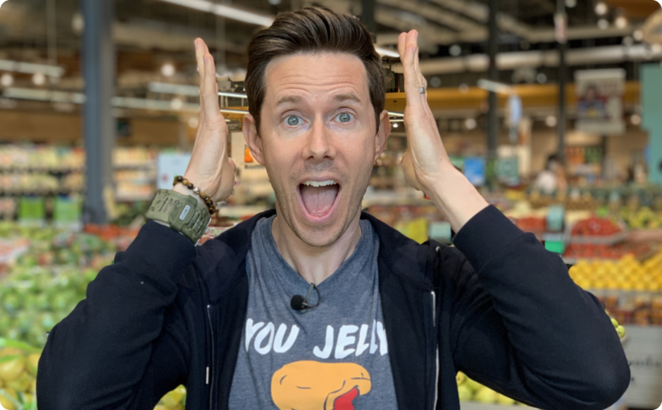 Person with an excited yet shocked face at a grocery store