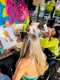 Guest painting at an easel