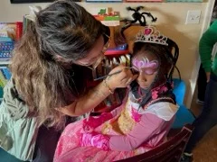 Face painting artist applying a design