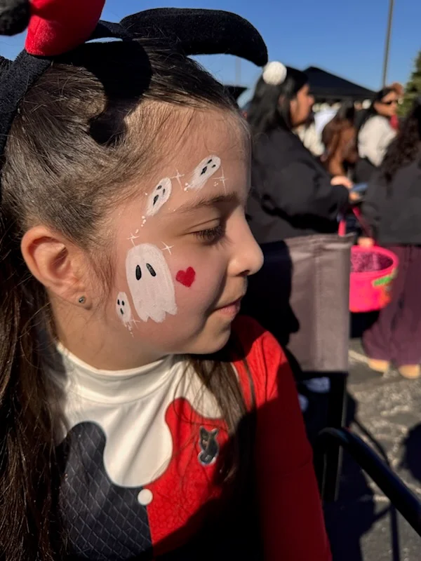 Ghost face paint at a fall celebration
