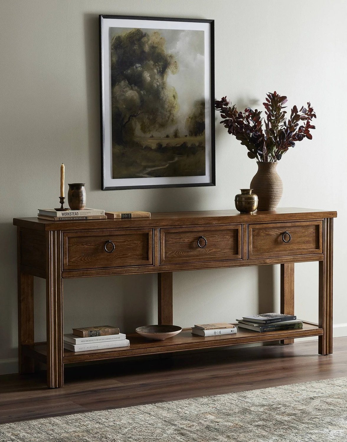 Gray throw with beige tassels drapped over a beige sectional
