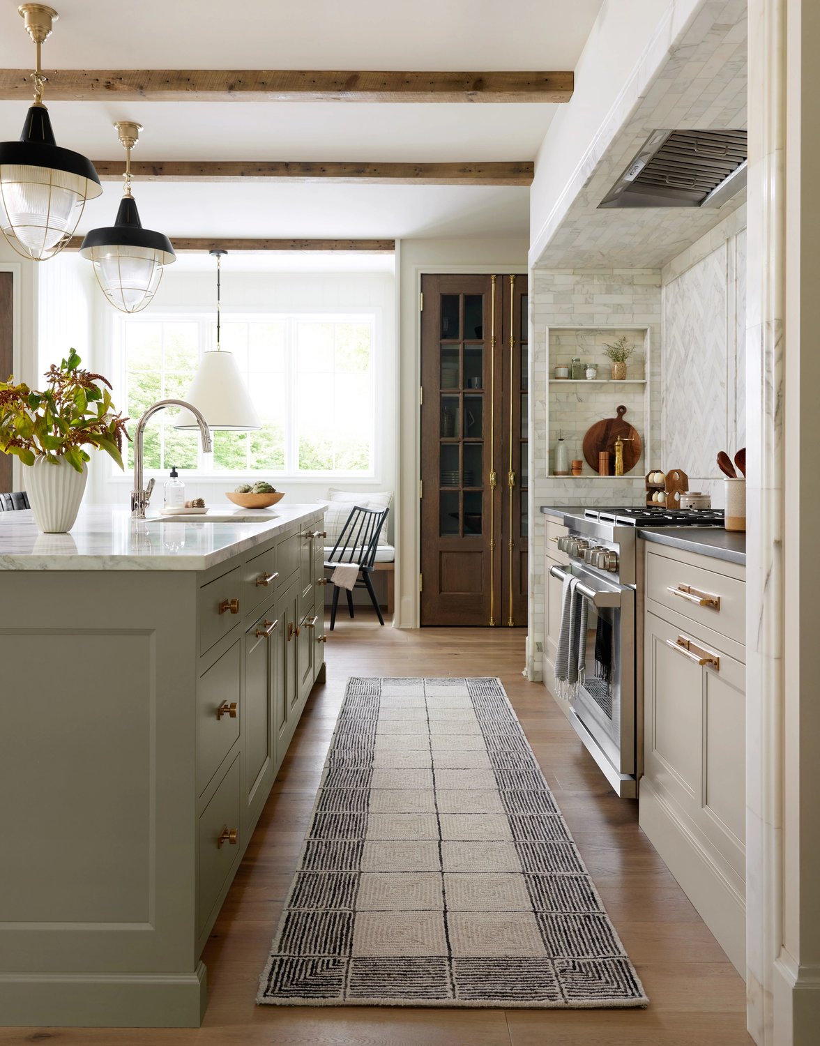 Kitchen with large island and geometric runner rug on the floor