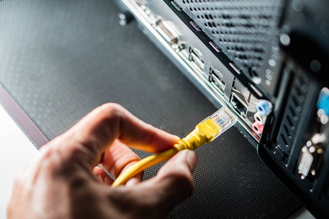 people around a boardroom-style table having a meeting