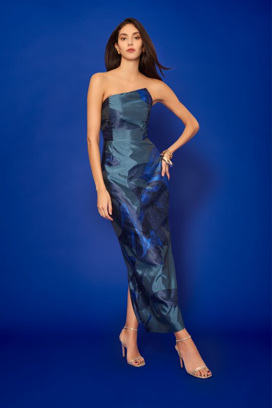 model wearing blue floral maxi dress