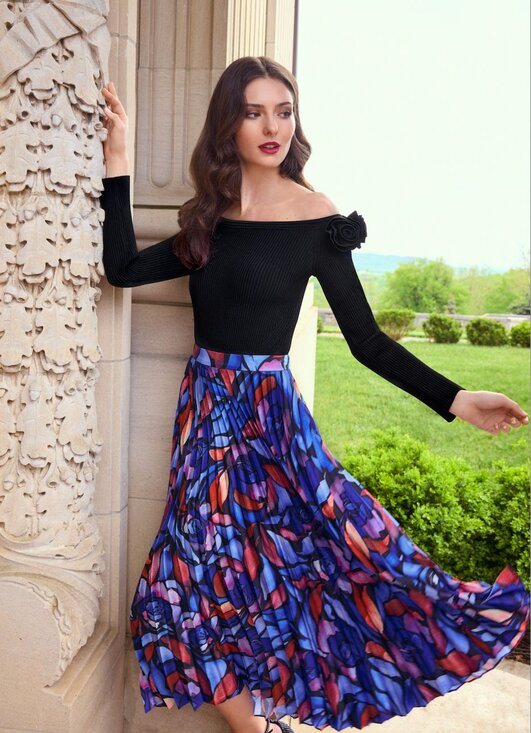 Black off the shoulder top and printed pleated midi skirt