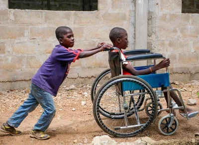 Child helping with wheelchair