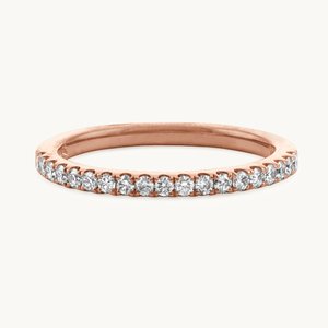 A rose gold pave wedding band