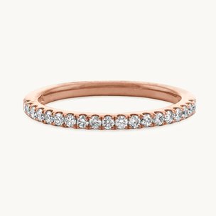 A rose gold pave wedding band