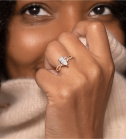 A woman wearing a 14k Yellow Gold Engagement Ring