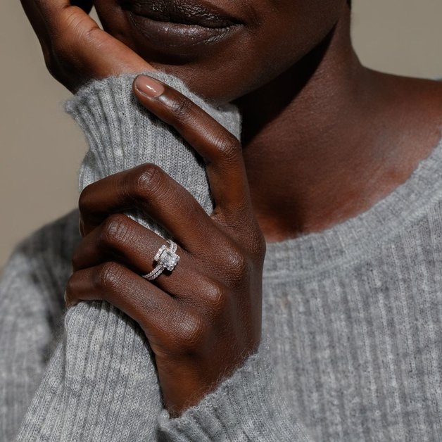 A woman wearing a diamond wedding ring set