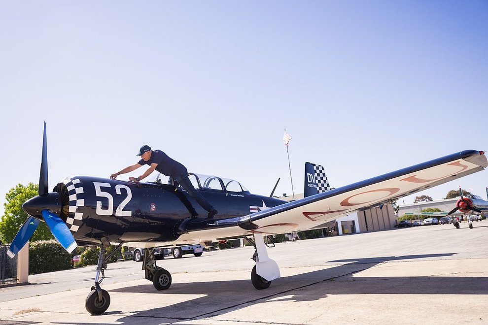 Mechanic on the wing of a Tiger Squadron plane