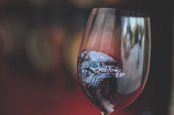 A glass of red wine in motion