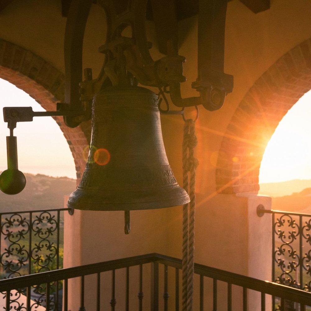 The bell in the bell tower at sunset
