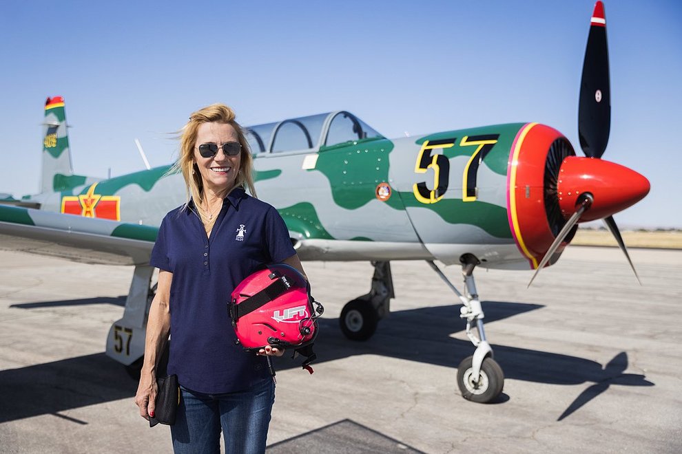 Woman in front of Tiger Squadron plane