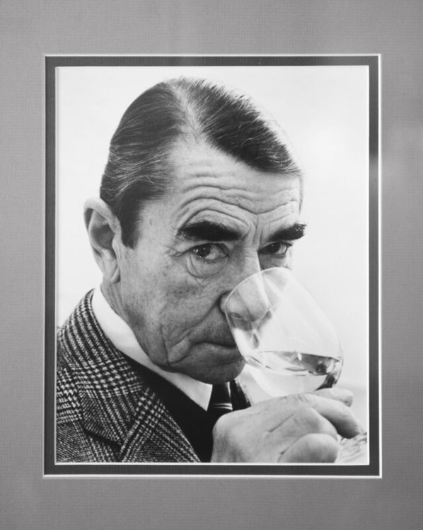 Portrait of Andre Tchelistcheff sniffing a glass of wine