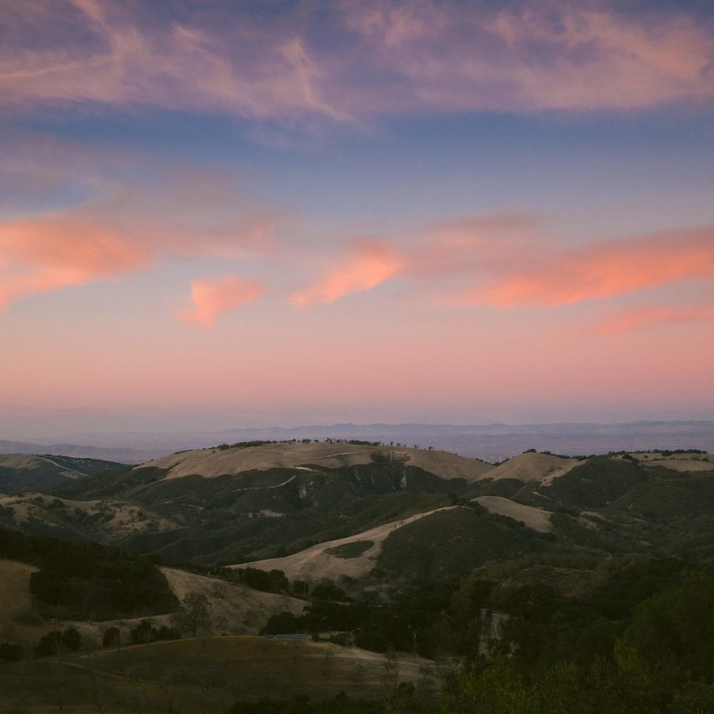The hills of Paso Robles with pink clouds at sunset