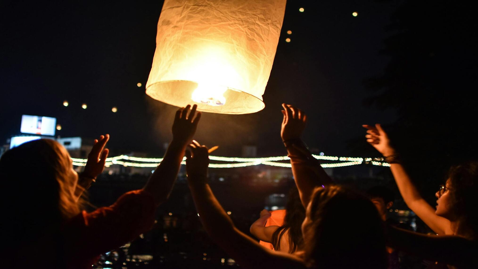 People releasing lanterns into the sky during the lantern festival