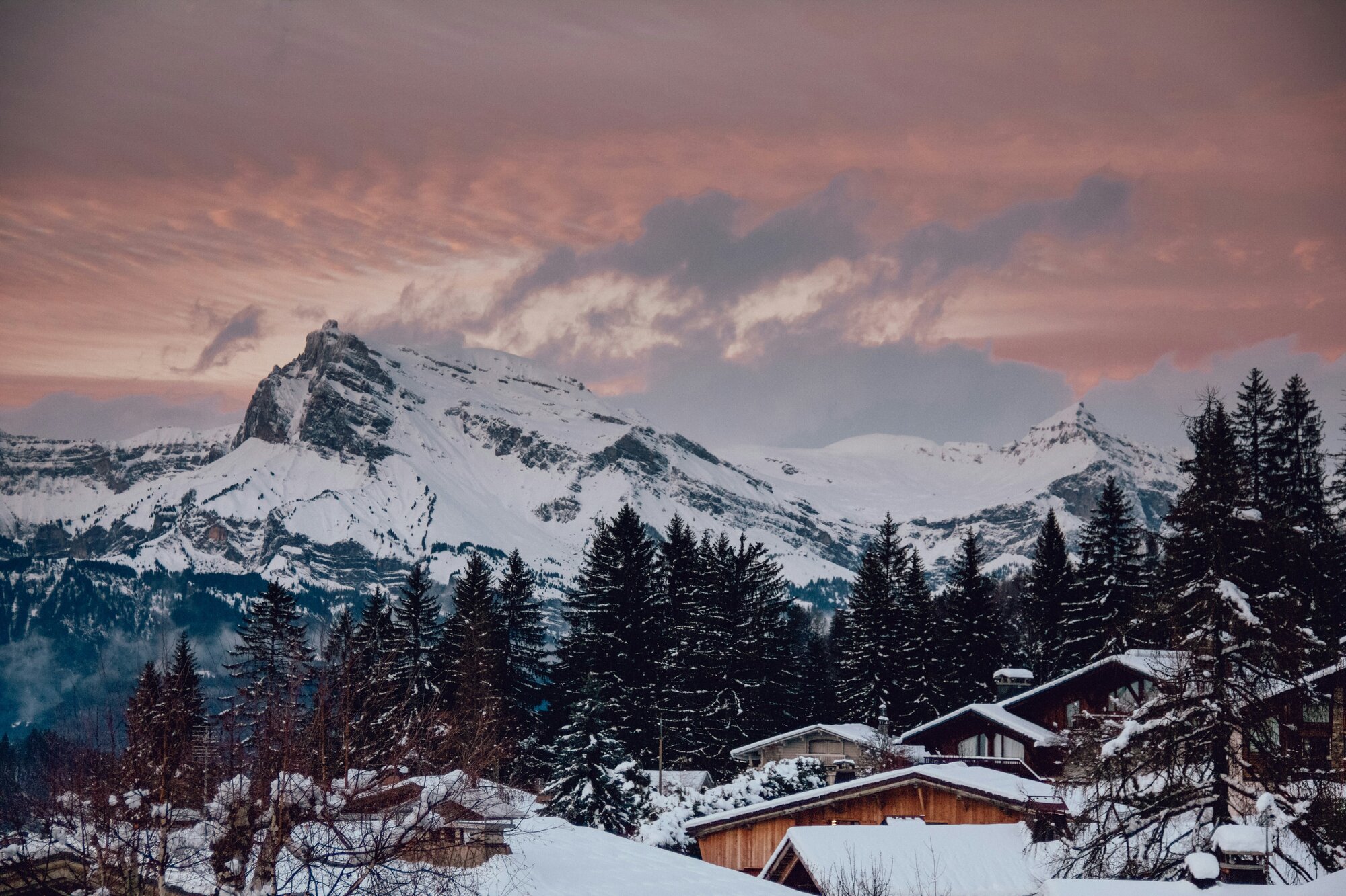 Ski trip with a chalet, mountains and sunset