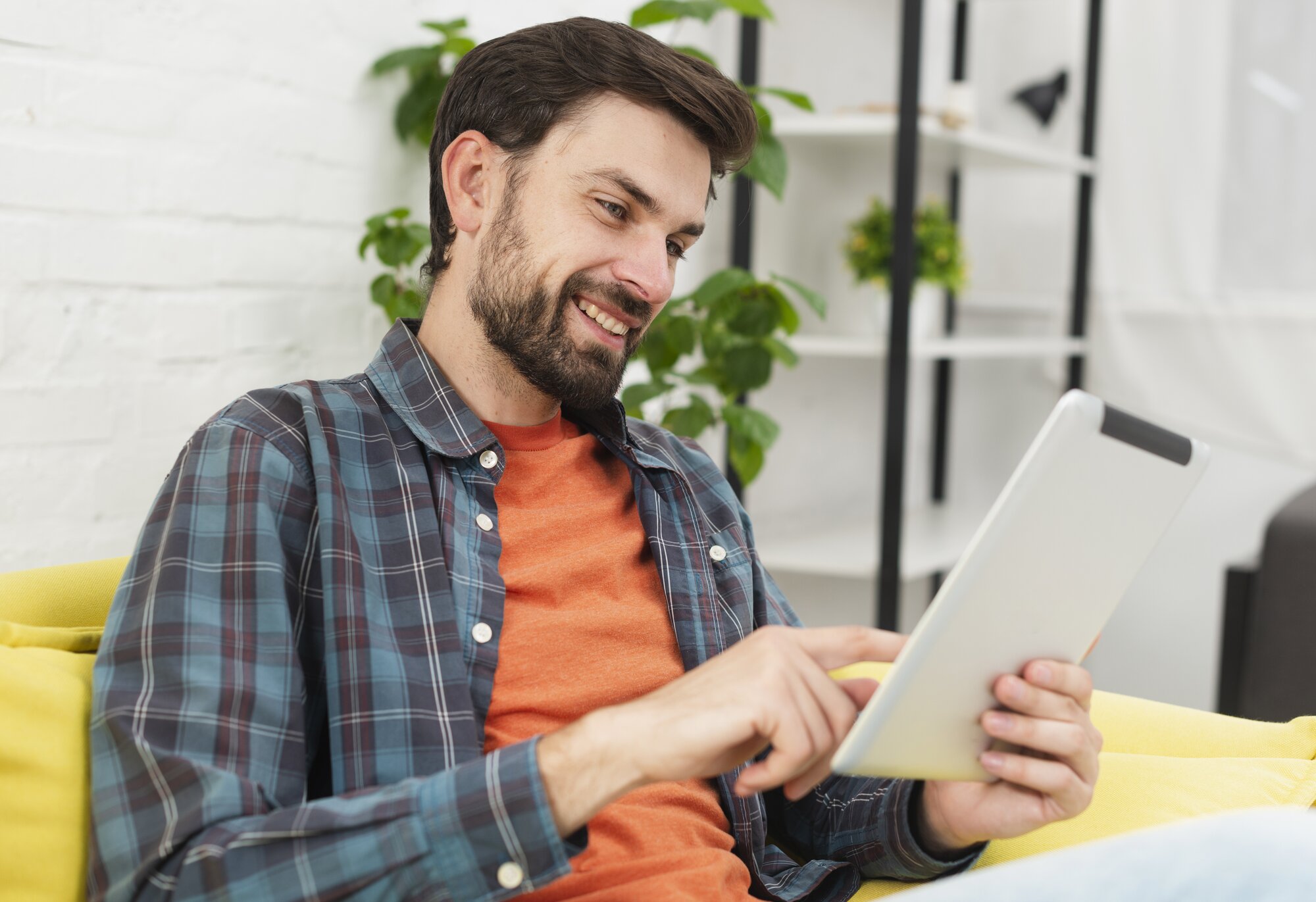 man looking at a tablet