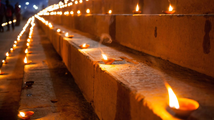 Varanasi's stone steps at night, lit by candles to celebrate the Dev Deepawali festival.