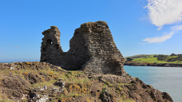 The 12th century ruins of Black Castle on the coast of Ireland near Wicklow on a sunny day.