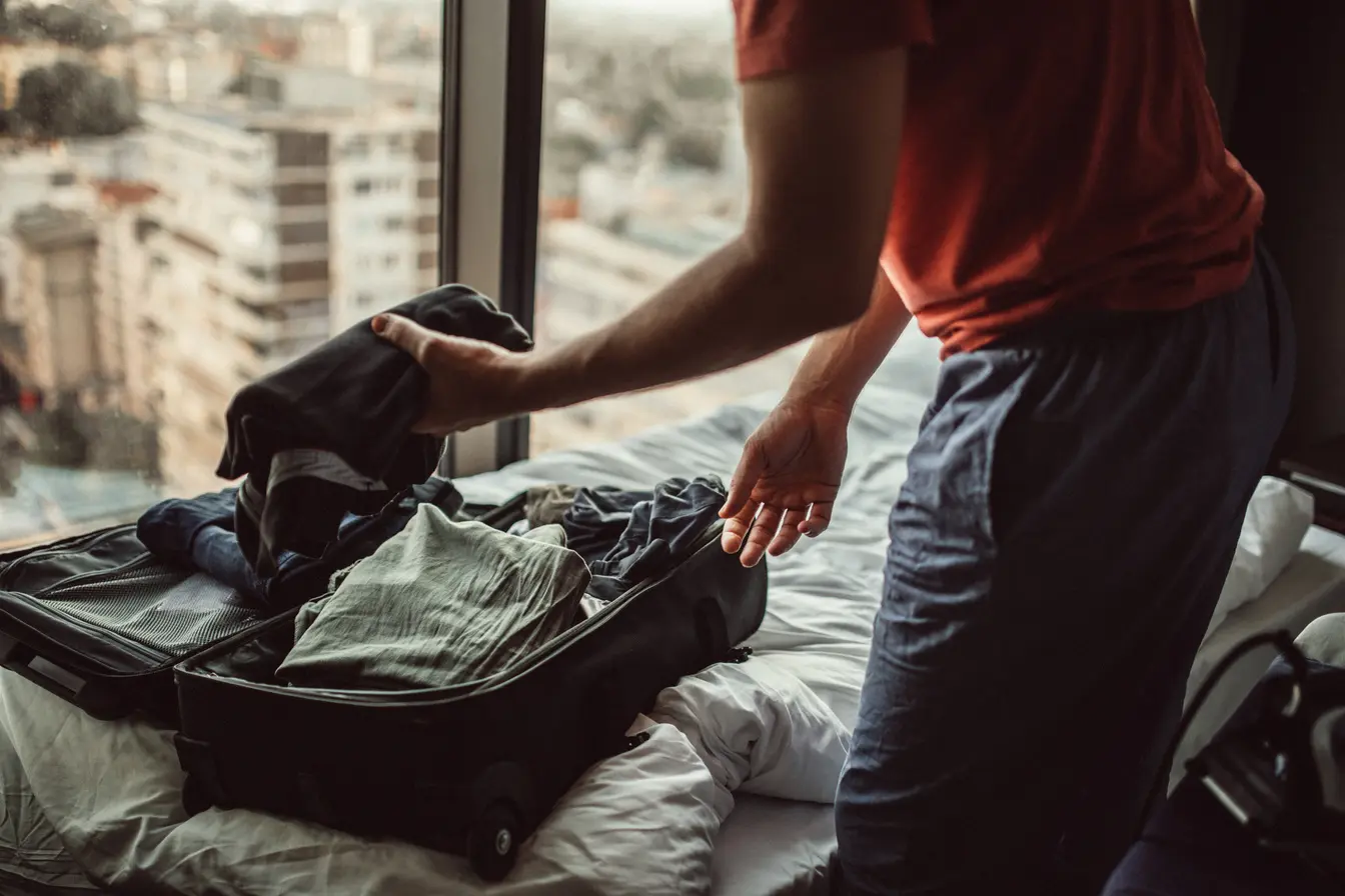 Person packing a suitcase for a trip to Mexico City in June