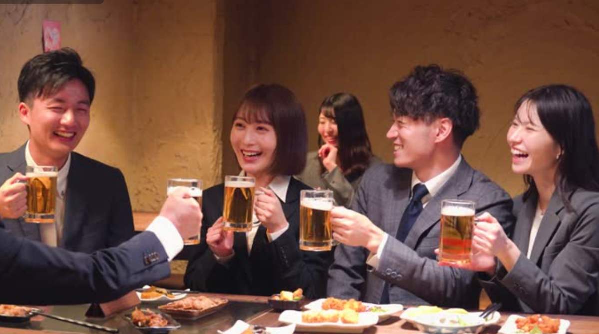 Chinese corporate workers having drinks over dinner