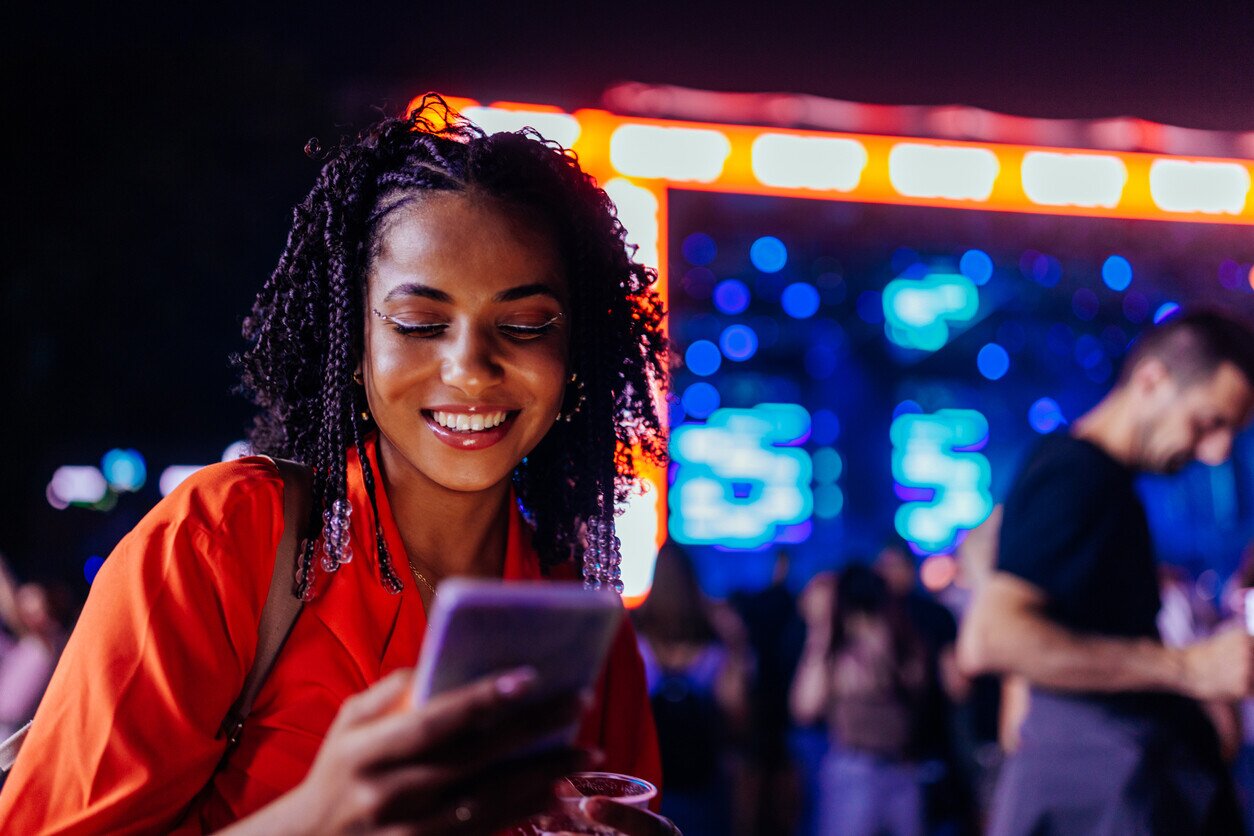 Woman at a festival using her phone
