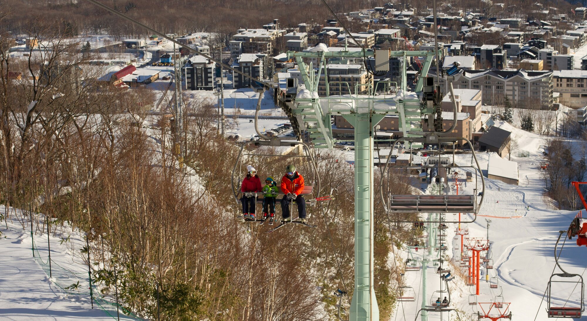 People on a ski lift in Niseko, Hokkaido, one of the best Japan ski trip destinations