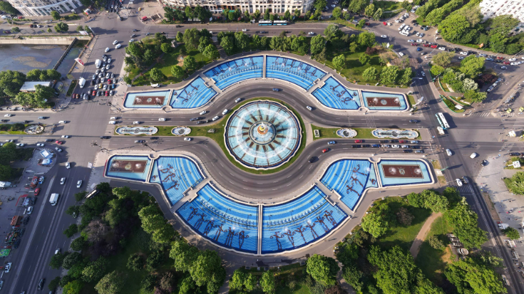 An arial image of a symmetrical set of fountains and park space in Bucharest, Romania, to illustrate a blog post entitled Extreme Day Trips Abroad from the UK