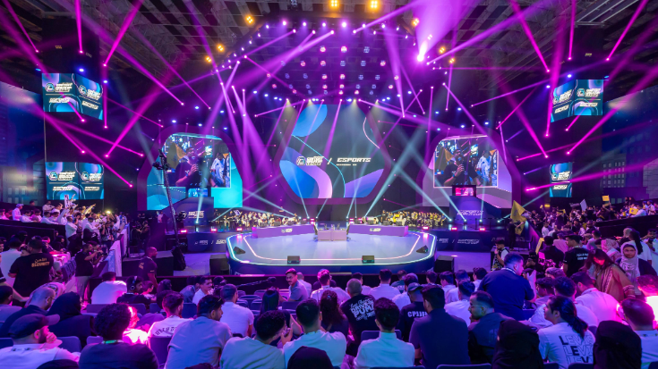 Esports World Cup 2024 crowd and stage lighting during a major match.