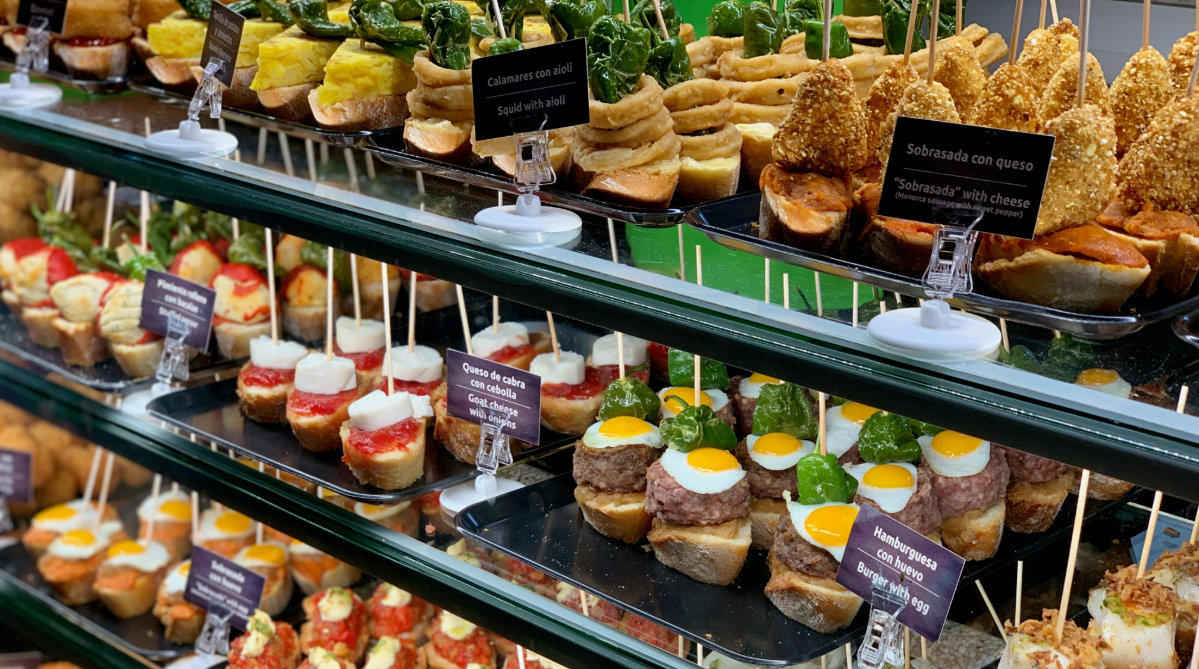 Tapas in a glass case at an eatery
