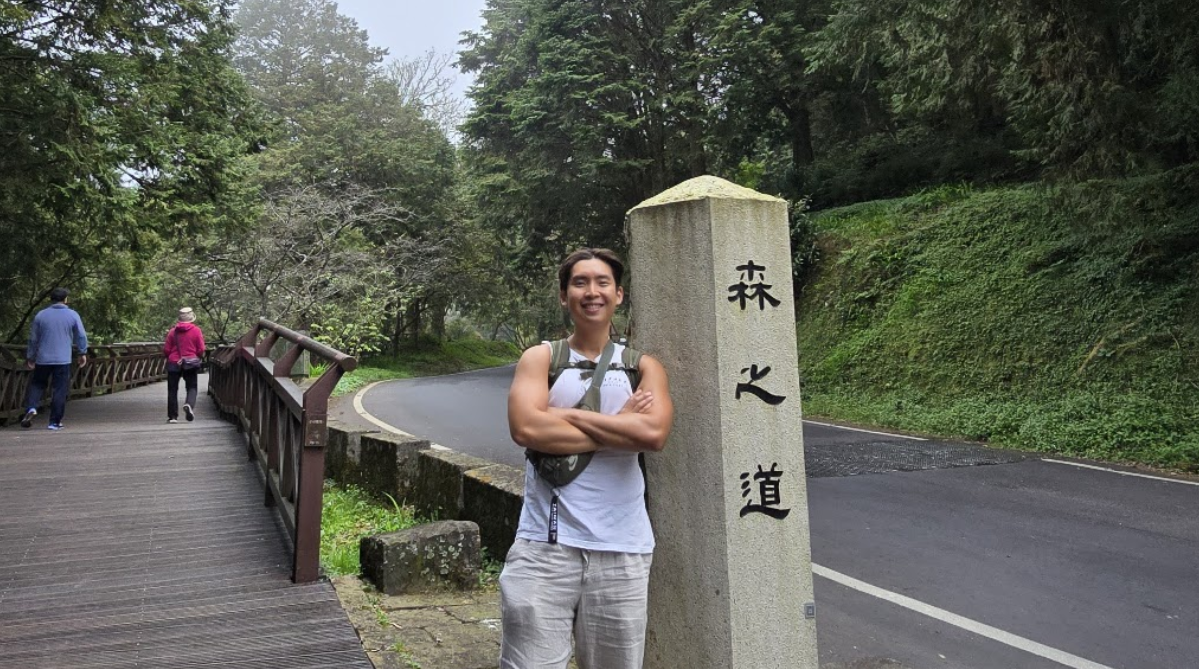 Man at the entrance to the forest area of the recreation area