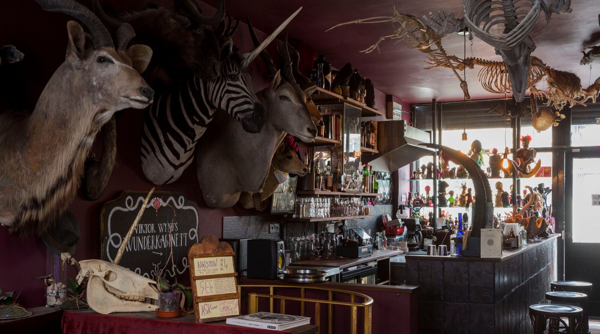 Animal heads and other oddities at the Absinthe Parlour, a hidden gem in London.