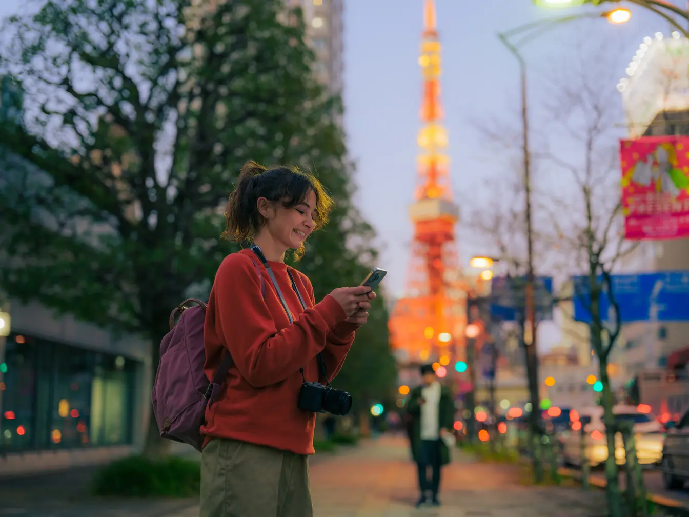 Traveler using phone in Tokyo, Japan