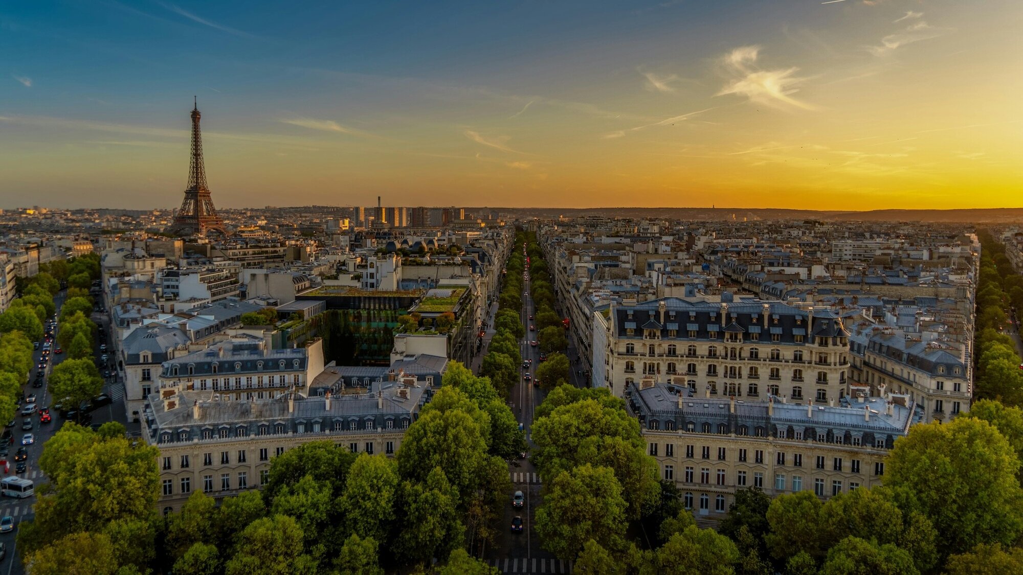An aerial view of Paris and the Eiffel Tower at sunset