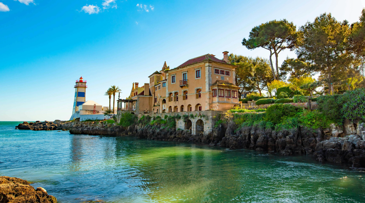 Beach cove and lighthouse in Cascais, Portugal