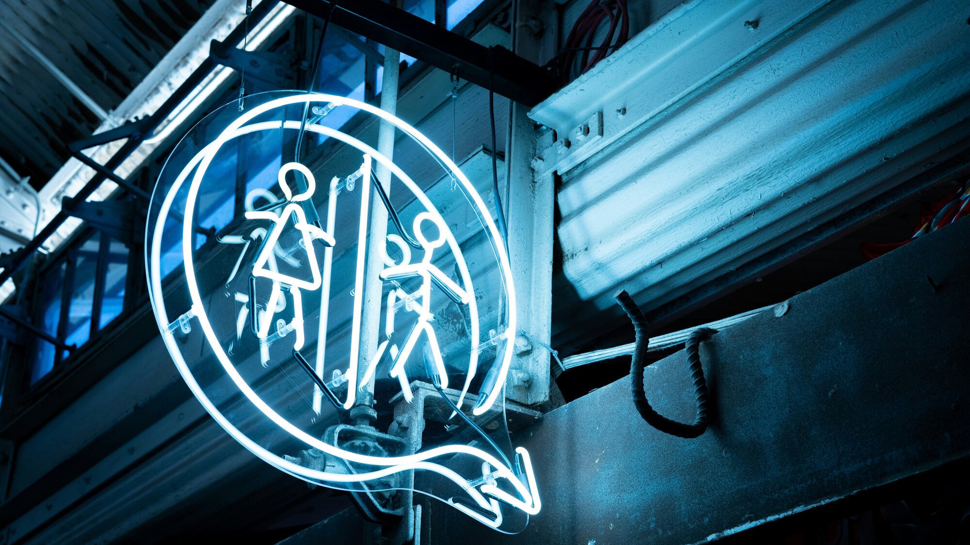 Neon lights indicating a bathroom is nearby