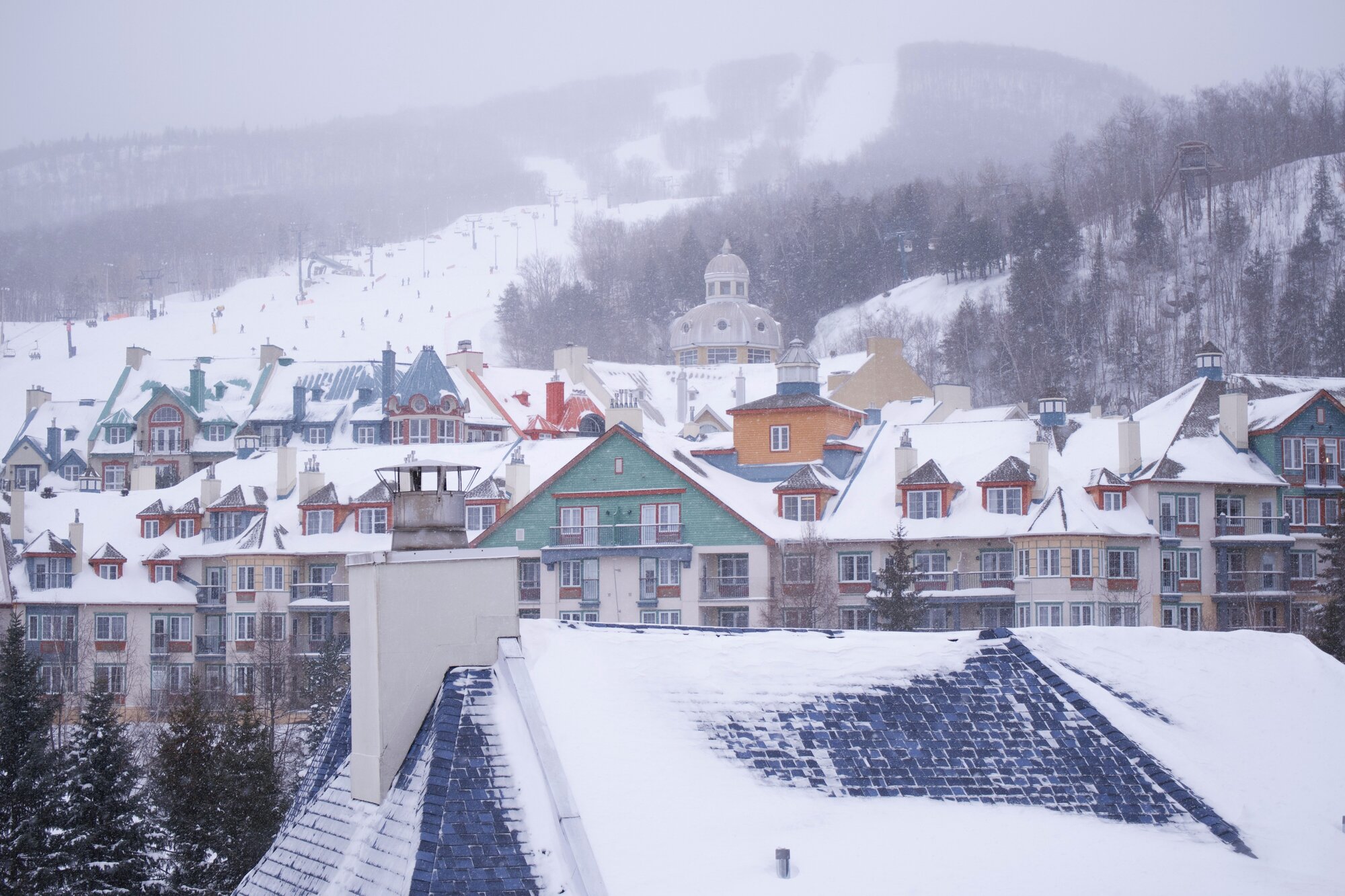 Buildings under the snow in Mont-Tremblant, Quebec, one of the best ski trips in North America