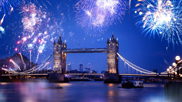 An image of fireworks going off over the River Thames, in shades of blue, red and gold, with the Tower of London in the background, to illustrate a blog post entitled 'Things to do in London in December'.