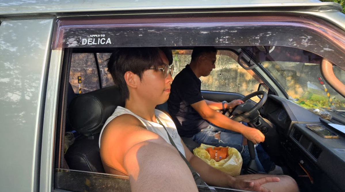 Man being driven around in a van on Xiaoliuqiu
