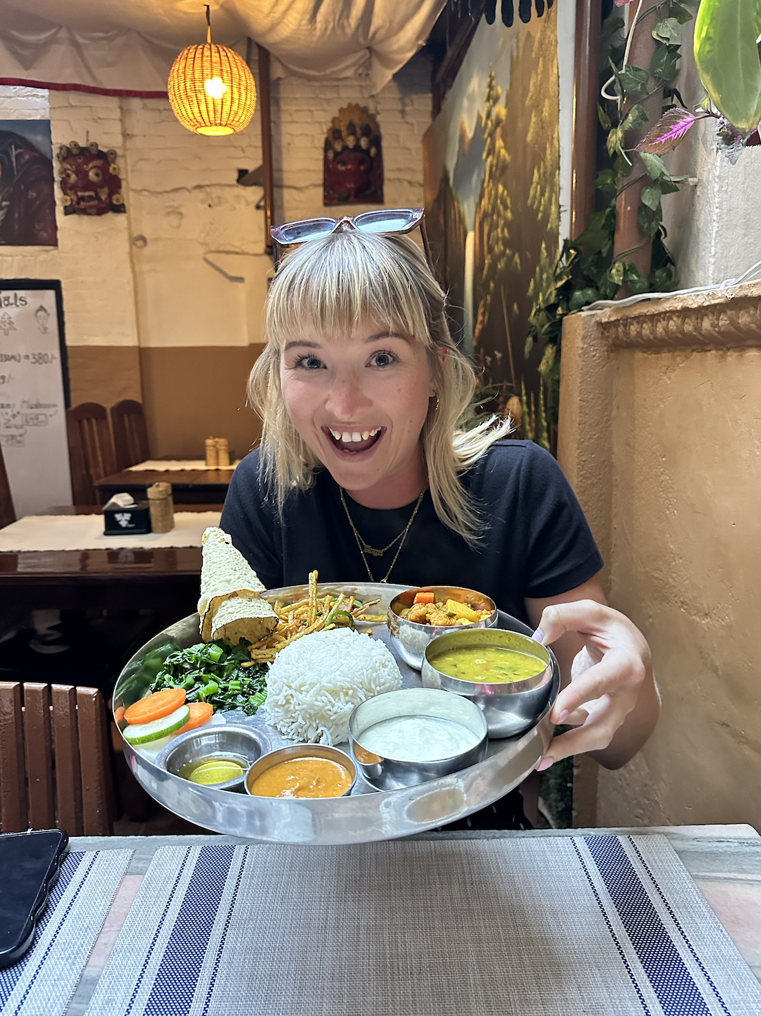 Molly holding authentic food in Nepal