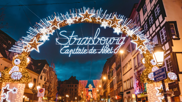A colour image showing the entrance gate to the start of main shopping street and city centre of Strasbourg at Christmas time  Alsace. To illustrate a blog post entitled 'Extreme Day Trips: Eurostar Christmas Markets Edition'.