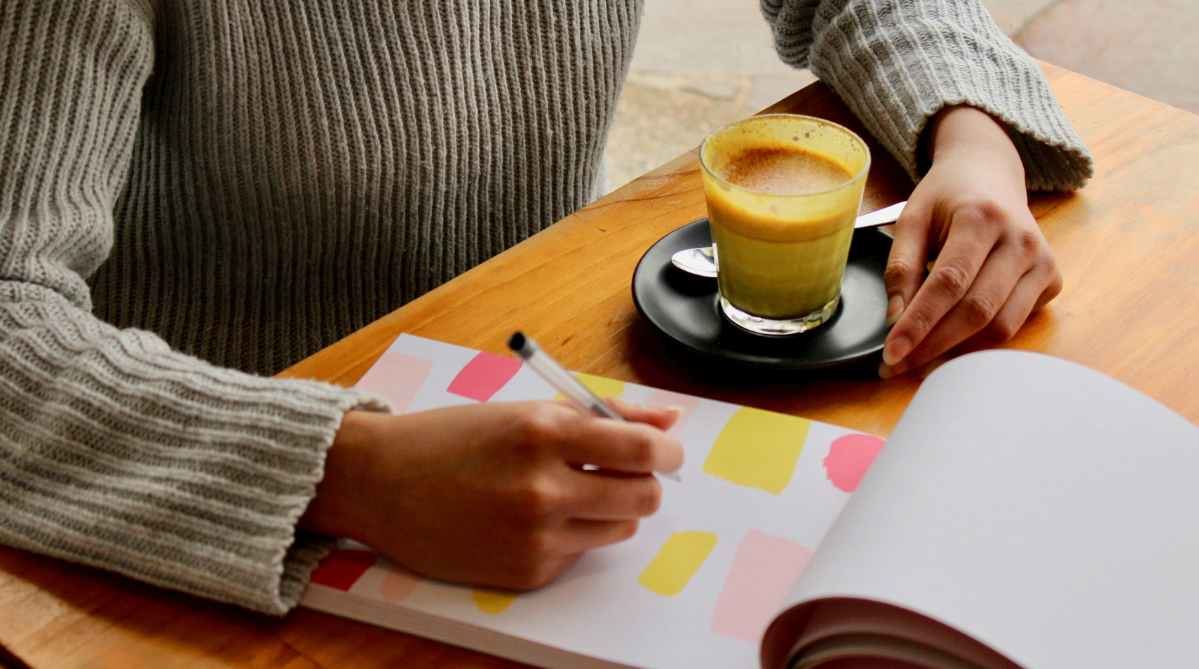 Person writing in a notebook