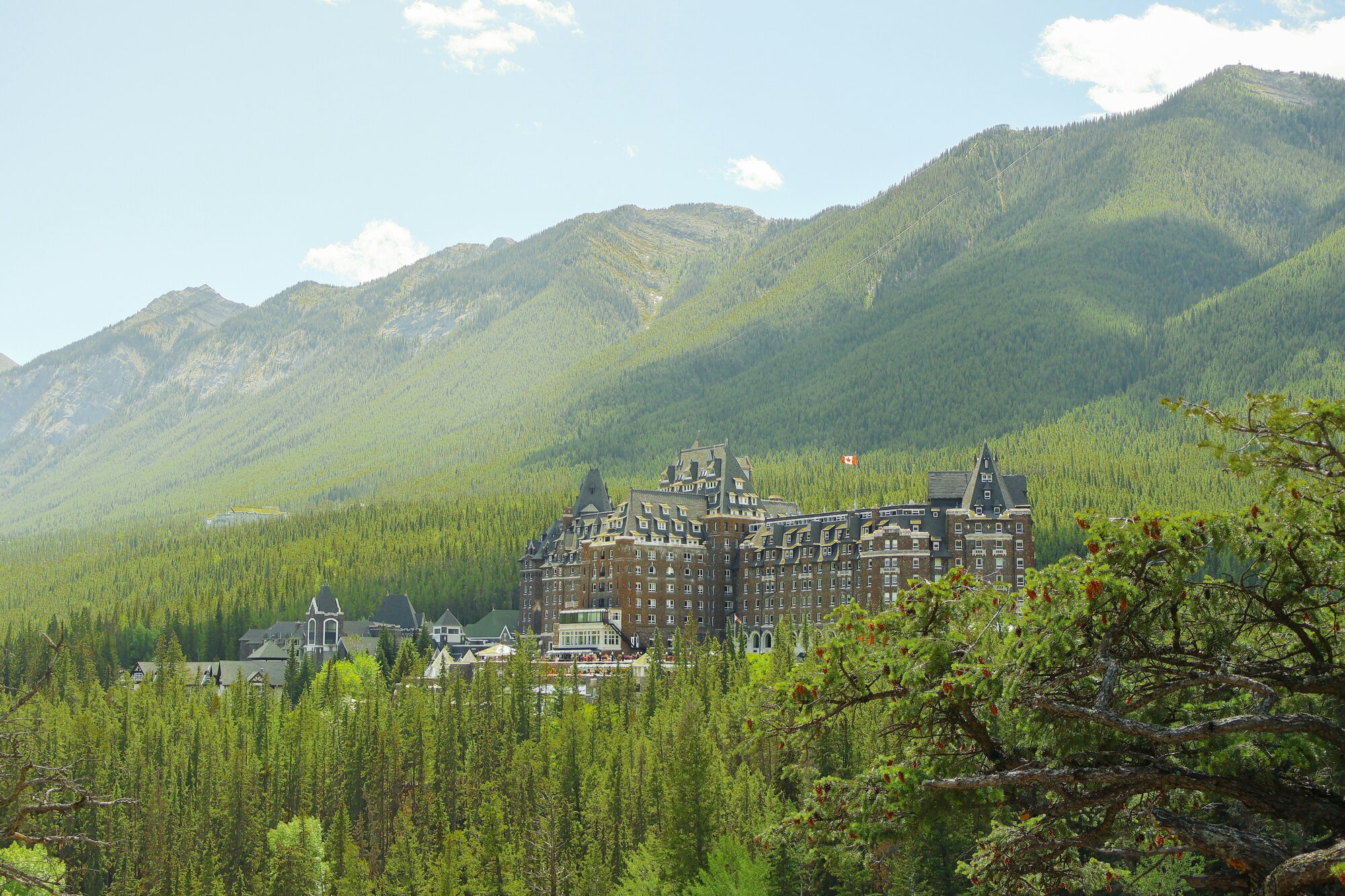 The Fairmont Banff Springs in Canada, a hotel next to mountains and trees
