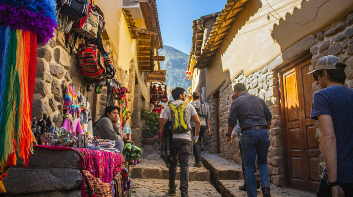 Traveler walking down a street in Cusco, Peru
