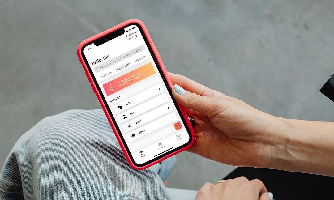 woman using airalo app on her iphone