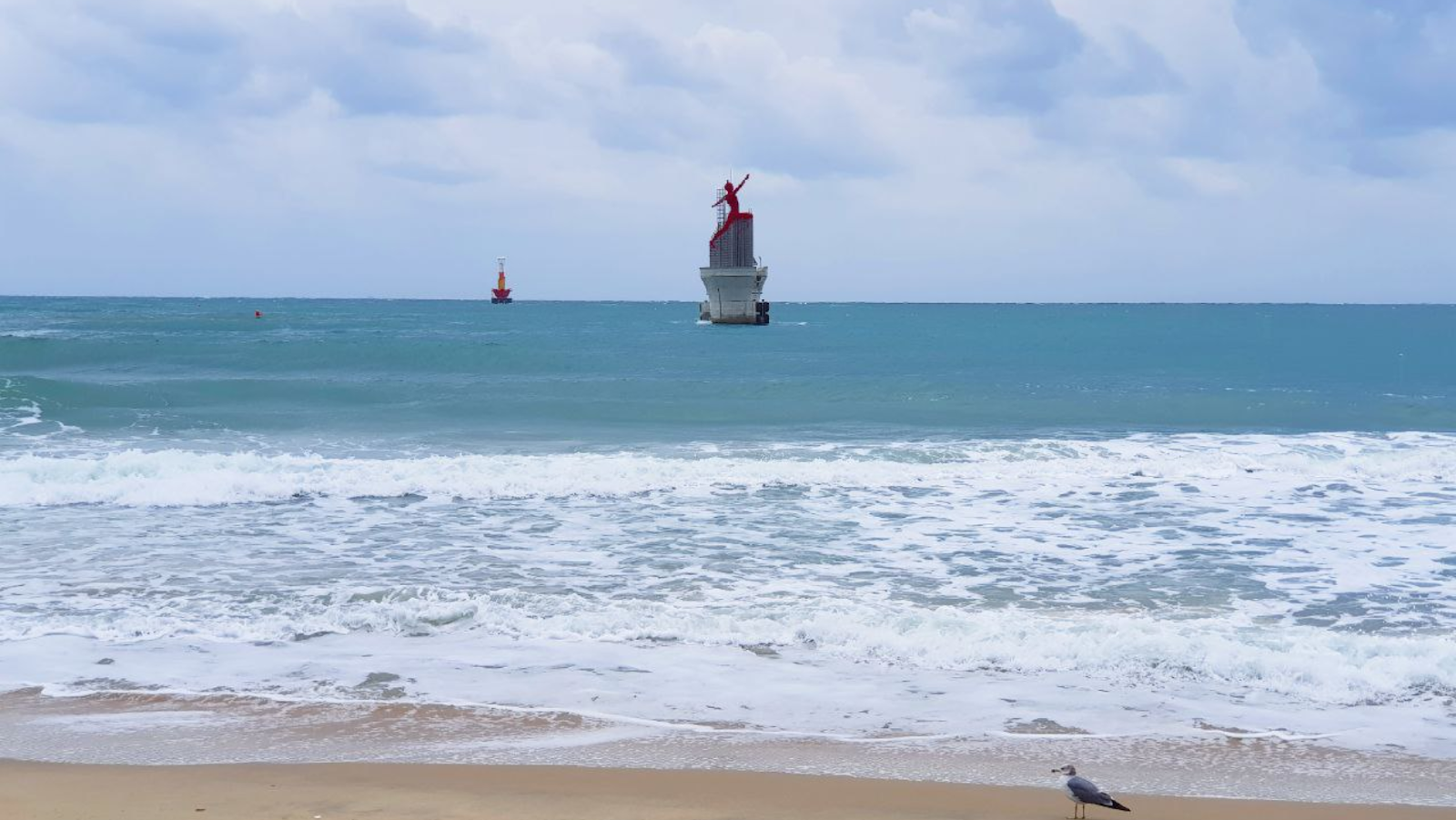 A ship on the sea viewed from Haeundae Beach (해운대해수욕장)