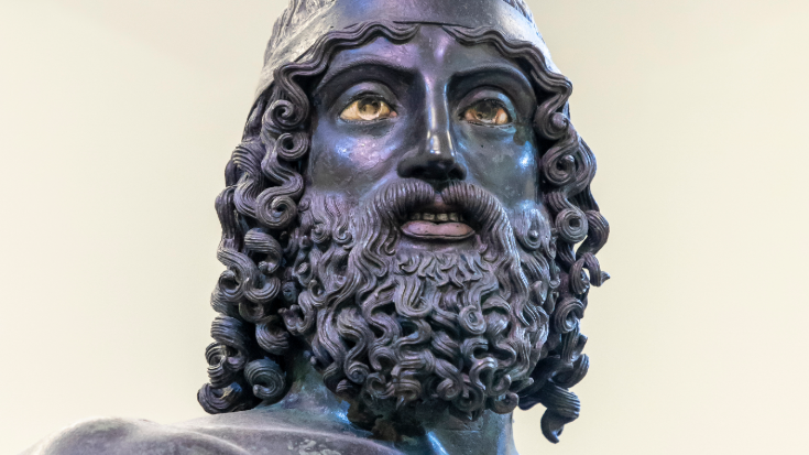 A close-up of the ancient Greek Riace Bronzes at the National Archaeological Museum, a top thing to do in Reggio Calabria, Italy.